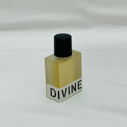 Small bottle labeled 'DIVINE' on a white background